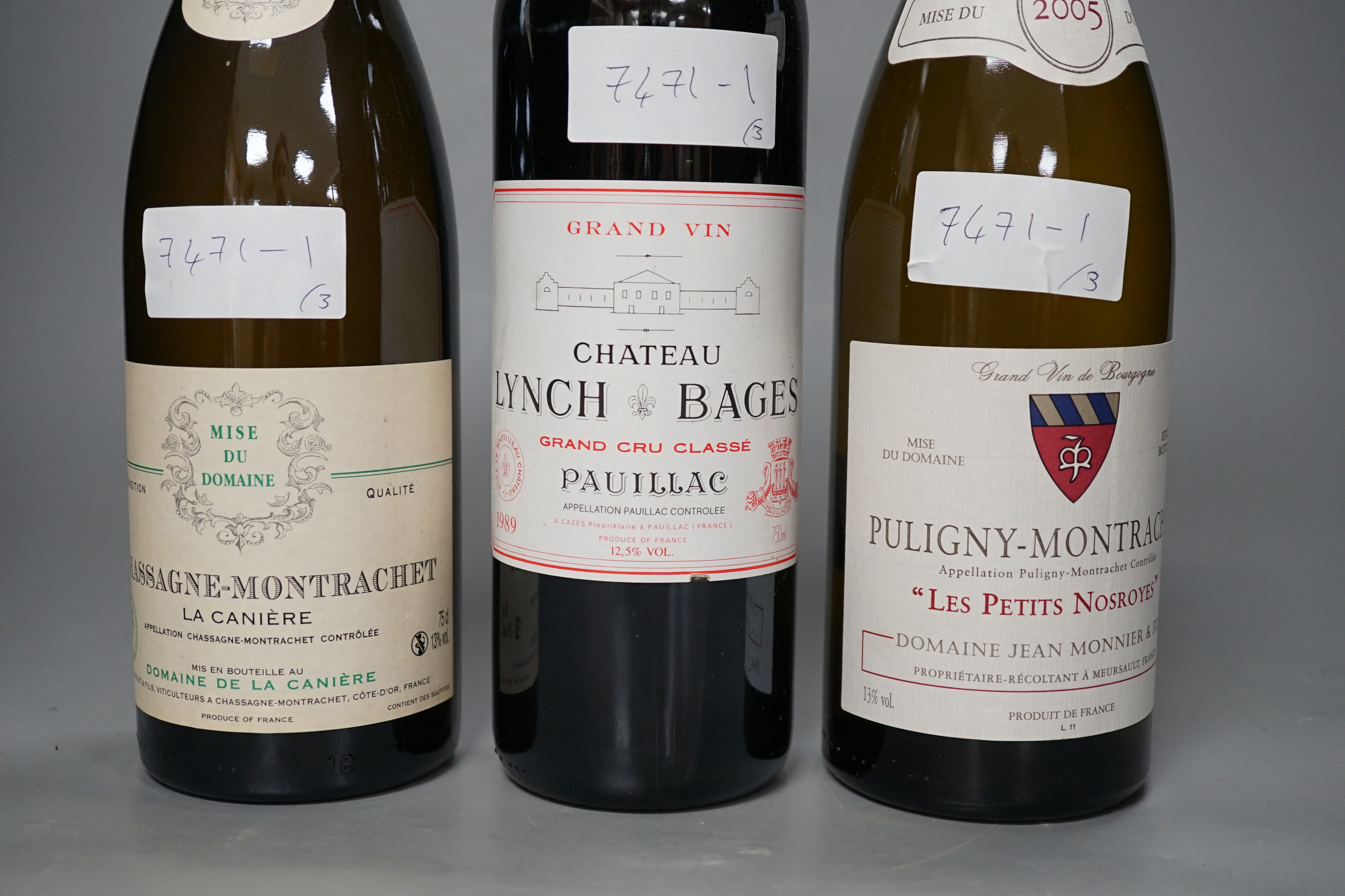 A bottle of Chateau Lynch Bages 1989, one bottle of Chassagne-Montrachet, 2004 and one Puligny Montrachet, 2005